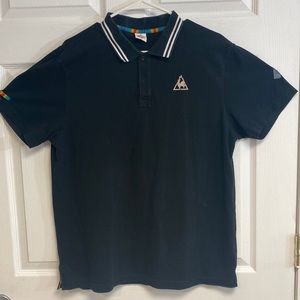 A black Le Coq Sportif Polo shirt